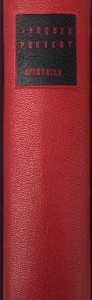 Plein cuir rouge, mosaïques noires évidéées représentant à l'identique le titrage du livre, tranchefile chapiteau bicolore rouge et noire, plats en cuir noir, charnieres en cuir, étui.
