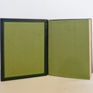 Douze cent mille de Luc Durtain, plein cuir. Gardes en soie verte, listels verts, charnières verts foncées.